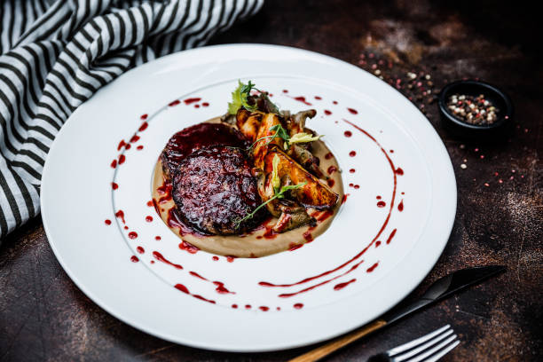 istock Main course. Beef medallions with potatoes and cream sauce. High cuisine. 1153306539