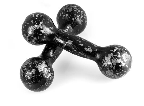 istock The metal old dumbbells on a white background top view, close-up 1153306579
