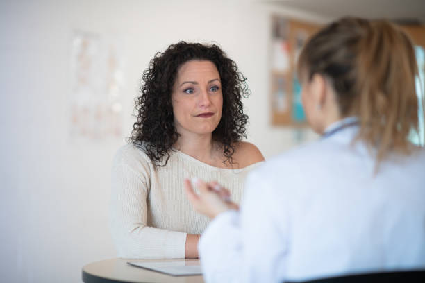 istock Woman talking to her doctor 1153306855