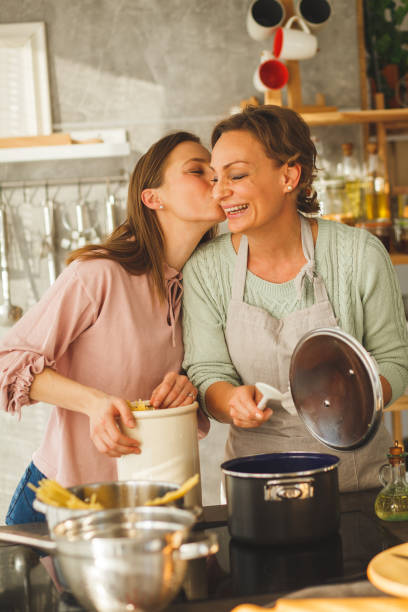 istock Mother and daughter bonding over cooking 1153306908