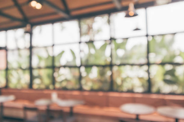 istock Cafe coffee shop interior abstract blur defocused with bokeh light background 1153307505