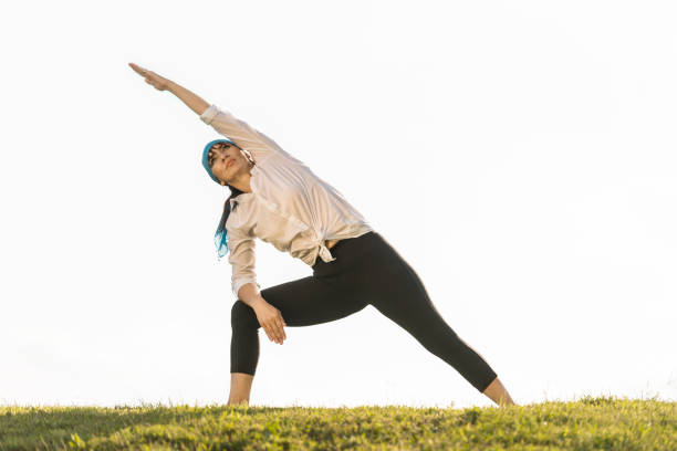 istock Mature woman practicing yoga in nature 1153308097