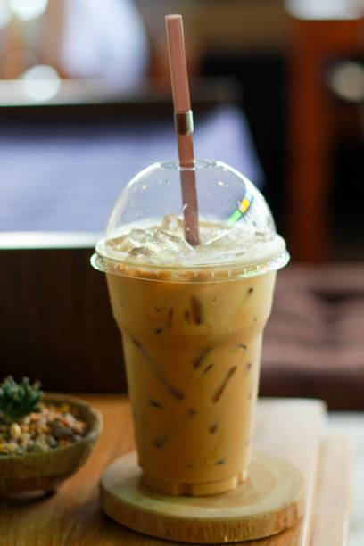 istock Close up espresso ice coffee on Wood table. 1153308163