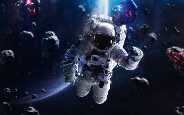 istock Meteorites and astronaut. Deep space image, science fiction fantasy in high resolution ideal for wallpaper and print. Elements of this image furnished by NASA 1153308192