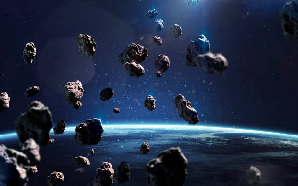 istock Asteroids near Earth. Meteorites orbiting planet. Deep space image, science fiction fantasy in high resolution ideal for wallpaper and print. Elements of this image furnished by NASA 1153308215