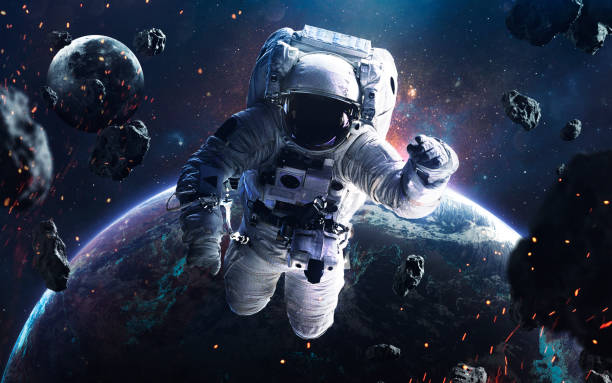 Picture of astronaut spacewalking at the earth orbit with glowing stars and asteroids. Deep space image, science fiction fantasy in high resolution ideal for wallpaper and print. Elements of this image furnished by NASA Picture of astronaut spacewalking at the earth orbit with glowing stars and asteroids. Deep space image, science fiction fantasy in high resolution ideal for wallpaper and print. Elements of this image furnished by NASA spacewalk photos stock pictures, royalty-free photos & images