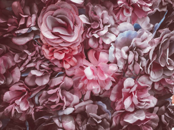 istock beautiful artificial flowers background, vintage style; 1153308250