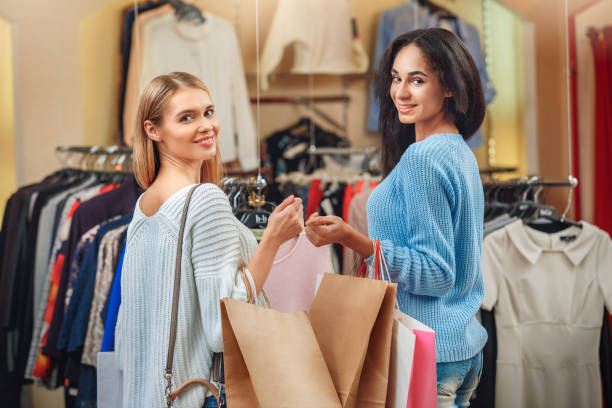 istock Young people shopping in a mall leisure 1153308279