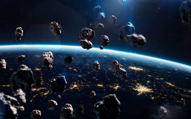 istock Asteroids near Earth. Meteorites orbiting planet. Deep space image, science fiction fantasy in high resolution ideal for wallpaper and print. Elements of this image furnished by NASA 1153308368