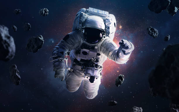 Picture of astronaut spacewalking at the awesome cosmic backgrouds with glowing stars and asteroids. Deep space image, science fiction fantasy in high resolution ideal for wallpaper and print. Elements of this image furnished by NASA Picture of astronaut spacewalking at the awesome cosmic backgrouds with glowing stars and asteroids. Deep space image, science fiction fantasy in high resolution ideal for wallpaper and print. Elements of this image furnished by NASA spacewalk photos stock pictures, royalty-free photos & images