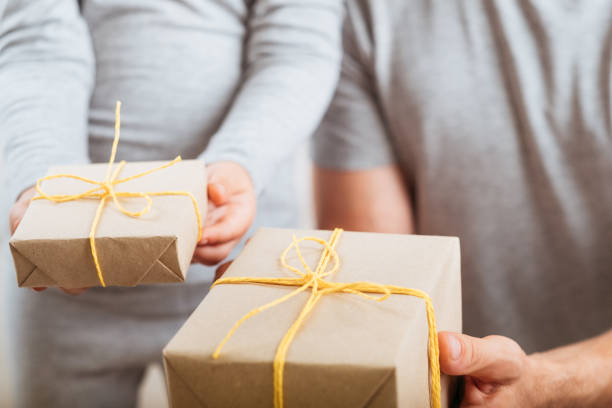 istock special day caring child father giving presents 1153308409