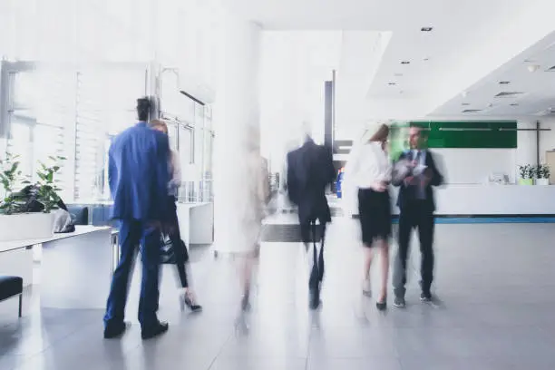 Photo of Businesspeople walking in corridor