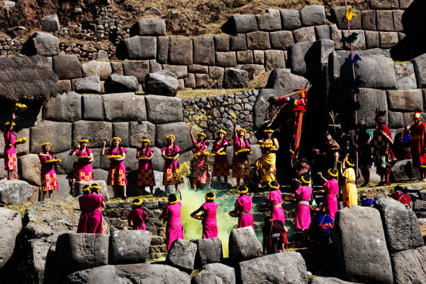 Young Women In Traditional Inca Costumes Carrying Bowls Of Yellow Flower Petals Cusco, Peru - June 24, 2015: Young Women Dressed In Traditional Inca Costumes For Inti Raymi Ceremony Throwing Yellow Flower Petals inti raymi stock pictures, royalty-free photos & images