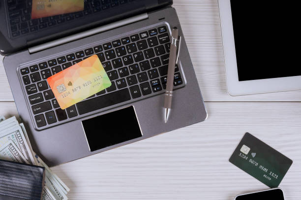 istock Using credit card and laptop, shopping online 1153310041