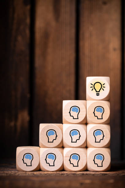 istock many people together having an idea symbolized by icons on cubes 1153311118