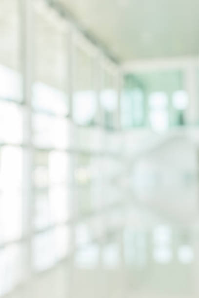 istock Office building blur background business lobby reception hall interior or empty indoor foyer meeting room with blurry light from glass wall window 1153311126