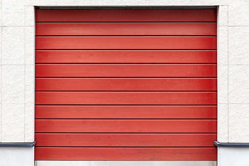 Red wood garage door at home