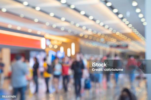 Blurred Defocused Background Of Crowd In Trade Event Exhibition Hall Business Trade Show Shopping Mall And Marketing Advertisement Concept Mice Industry Business Concept Stock Photo - Download Image Now