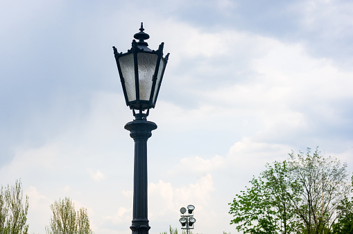 Classic style city lamppost at sunset, close-up