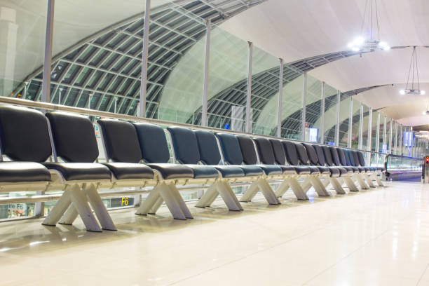 istock The empty airport terminal waiting area with chairs 1153318118