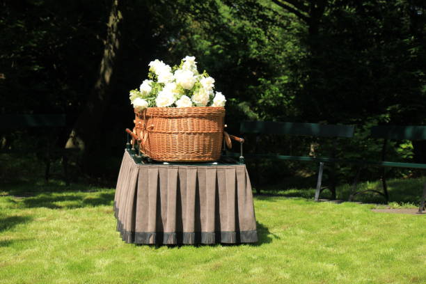 a willow casket - contemporary style A willow casket - Environmentally Friendly and contemporary style - on a catafalque during an outdoor ceremony coffin photos stock pictures, royalty-free photos & images