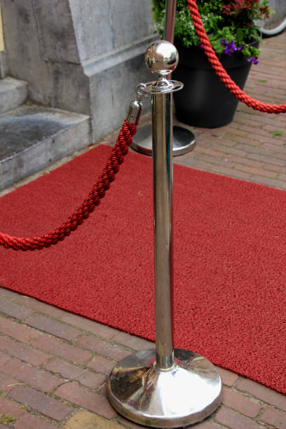 istock rope barriers on VIP entrance 1153321652