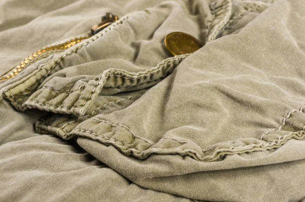 istock clothing items washed cotton fabric texture with seams, clasps, buttons and rivets 1153327645