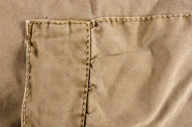 istock clothing items washed cotton fabric texture with seams 1153327735