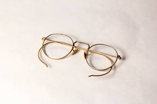 istock A pair of Antique Eyeglasses on a white background. 1153329288