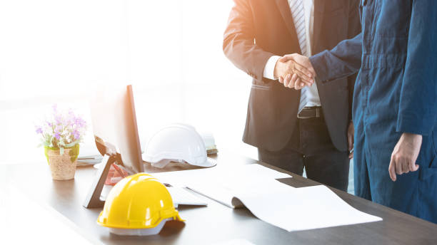 istock Some people handshake together in modern office. 1153333108