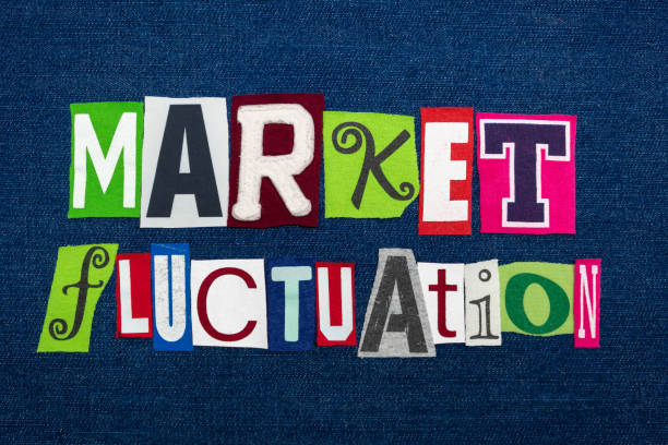istock MARKET FLUCTUATION text word collage, multi colored fabric on blue denim, stocks price changes concept 1153333803