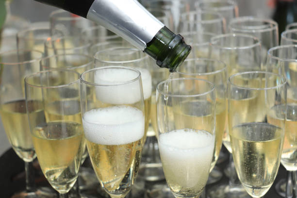 istock Pouring champagne in stylish glasses 1153337413