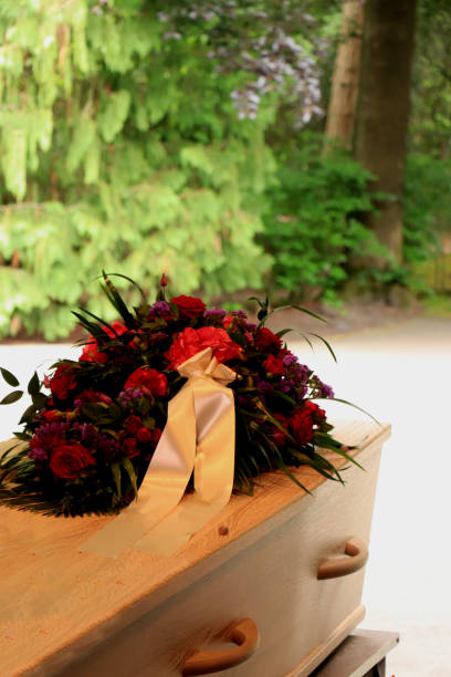 istock A coffin with a flower arrangement in a morgue 1153339925