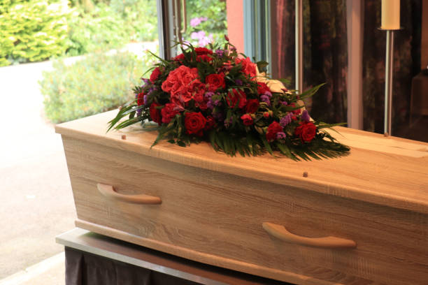 istock A coffin with a flower arrangement in a morgue 1153340086