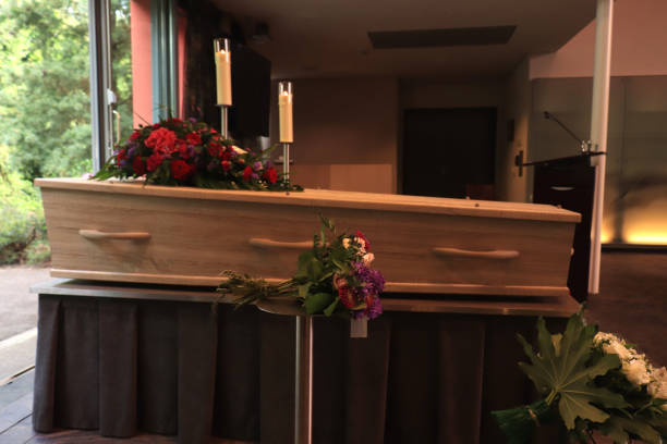 istock A coffin with a flower arrangement in a morgue 1153340137