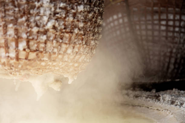 istock Fire smoke with salt in bamboo basket. 1153343125