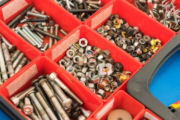 istock Different Nuts Screws bolts and other Parts sorted in box 1153344616