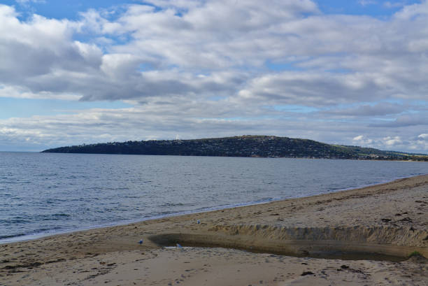 istock Mountain and clouds at the beach 1153344797