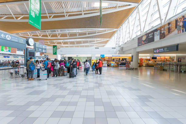 crowed of tourists at departure hall of the new shin chitose airport in hokkaido,japan - new chitose imagens e fotografias de stock