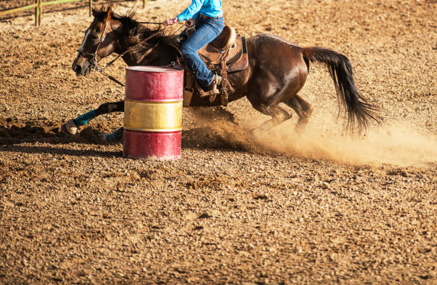 istock Young cowgirl barrel racing rodeo 1153347784