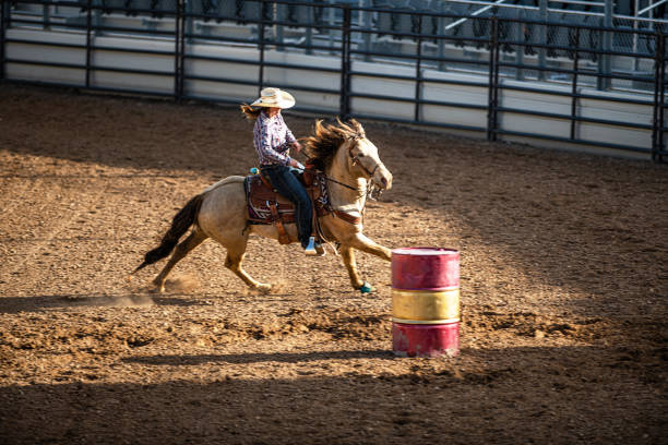 istock Young cowgirl barrel racing rodeo 1153348368