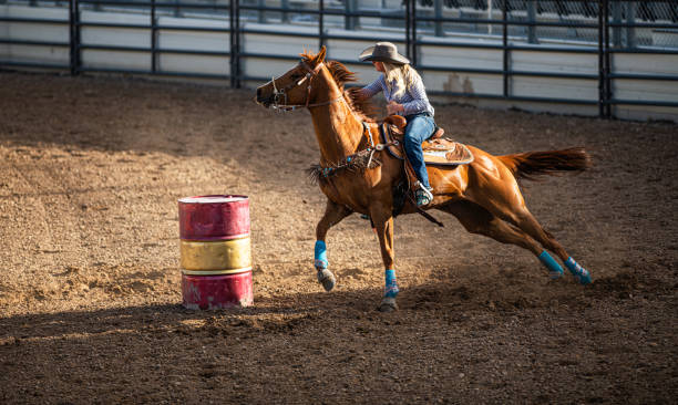 istock Young cowgirl barrel racing rodeo 1153348499
