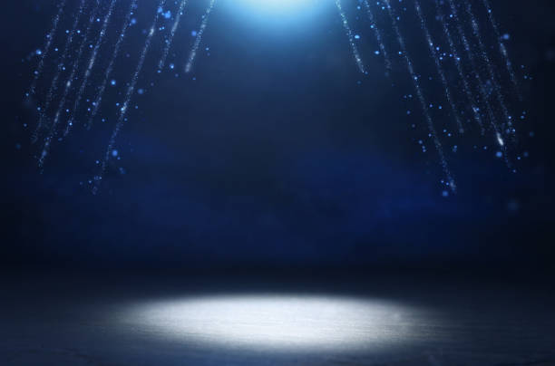 istock abstract dark concentrate floor scene with mist or fog, spotlight, glitter light bokeh for display 1153349413