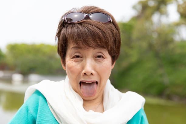 istock Senior woman making funny face 1153355300
