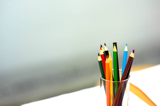 istock Colored pencils in a glass 1153356672
