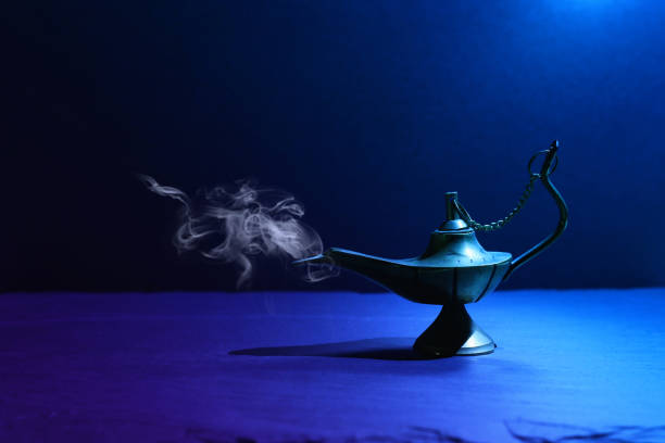 istock Image of magical mysterious aladdin lamp with smoke. Dark background and dramatic light 1153358489