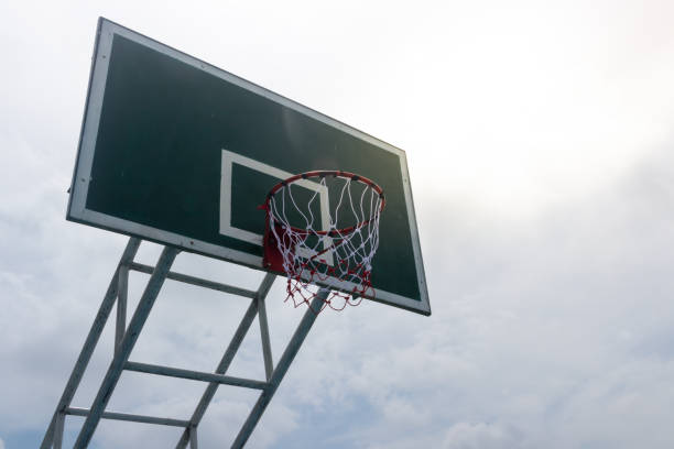 istock Low angle of the basketball pad with a metal loop and a white mesh 1153358686