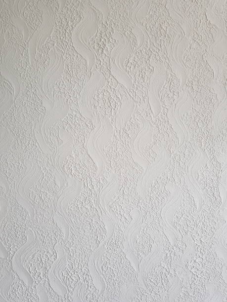 istock Mobile photography - a snapshot on a mobile phone camera - a vertically positioned manually plastered white wall. 1153360029