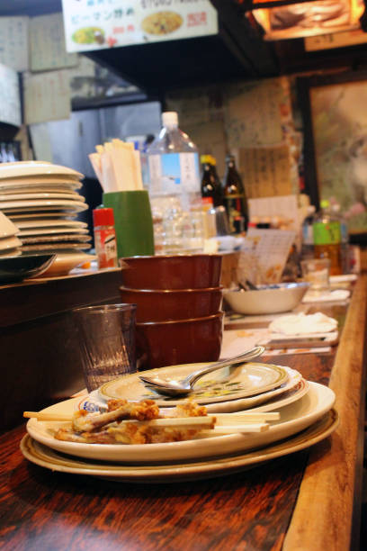 istock Empty plates and cups at traditional izakaya 1153360773