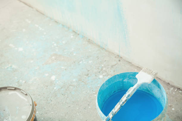 istock Paintbrush with blue paint. Renovation 1153361263